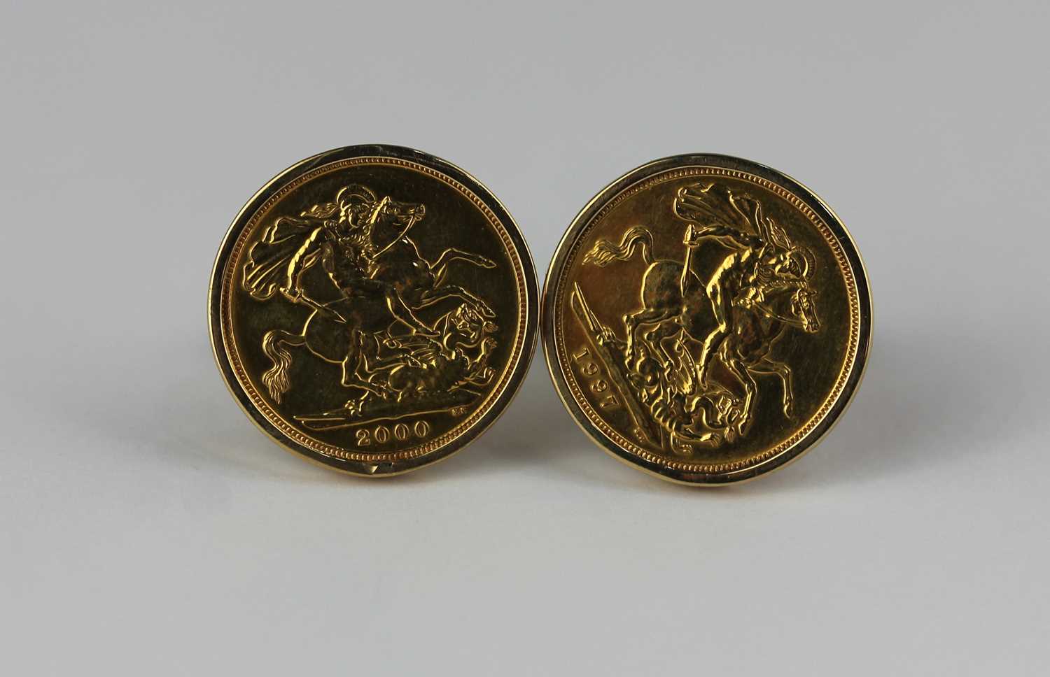 A pair of gold mounted sovereign cufflinks the sovereigns 1997 and 2000, with a case, combined gross - Image 2 of 2