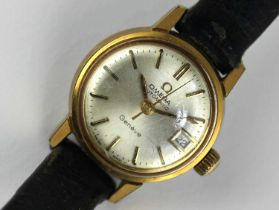 An Omega automatic gilt metal fronted and steel backed lady's wristwatch, the signed silvered dial