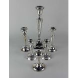 A George V silver candlestick, Chester 1917, 27cm high, a pair of George V silver candlesticks,