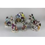 A Sitzendorf porcelain figure group of a courting couple holding flowers 13cm high, together with