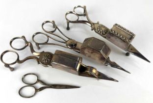 Three silver plated candle snuffers to include a guillotine example and a pair of sewing scissors