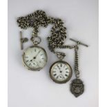 A silver graduated curb link watch Albert chain fitted with a silver fob medal, silver T bar and
