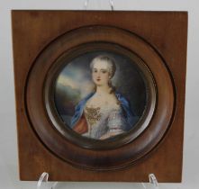 An early 20th century portrait miniature of a lady in early 19th century costume, indistinctly
