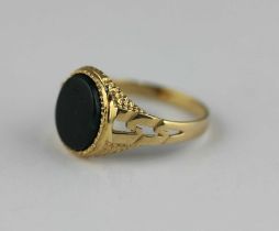 A 9ct gold and oval bloodstone signet ring, with textured decoration and pierced shoulders, ring