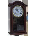 A mahogany cased wall clock with Westminster chimes, circular dial marked 'Highlands' 45cm high