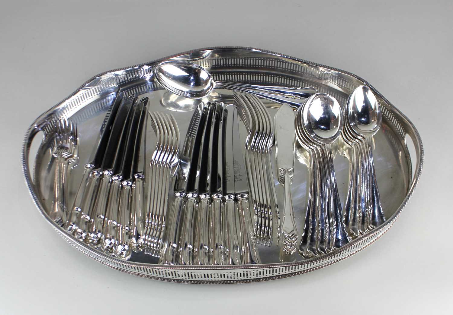 A set of six place setting plated Du Barry pattern flatware, and a plated oval tray with pierced