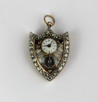 A gold and silver set diamond and enamelled shield shaped pendant watch, the enamelled dial with