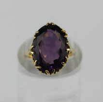 A 9ct gold and purple gem set ring ring size M