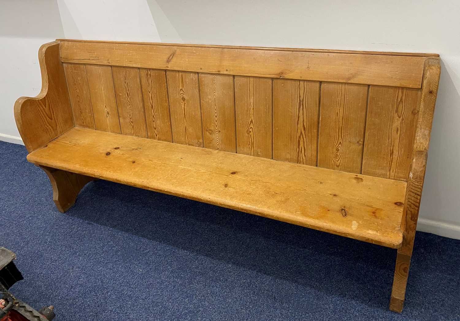 A pine church pew with plank back and shaped ends 192cm