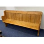 A pine church pew with plank back and shaped ends 192cm