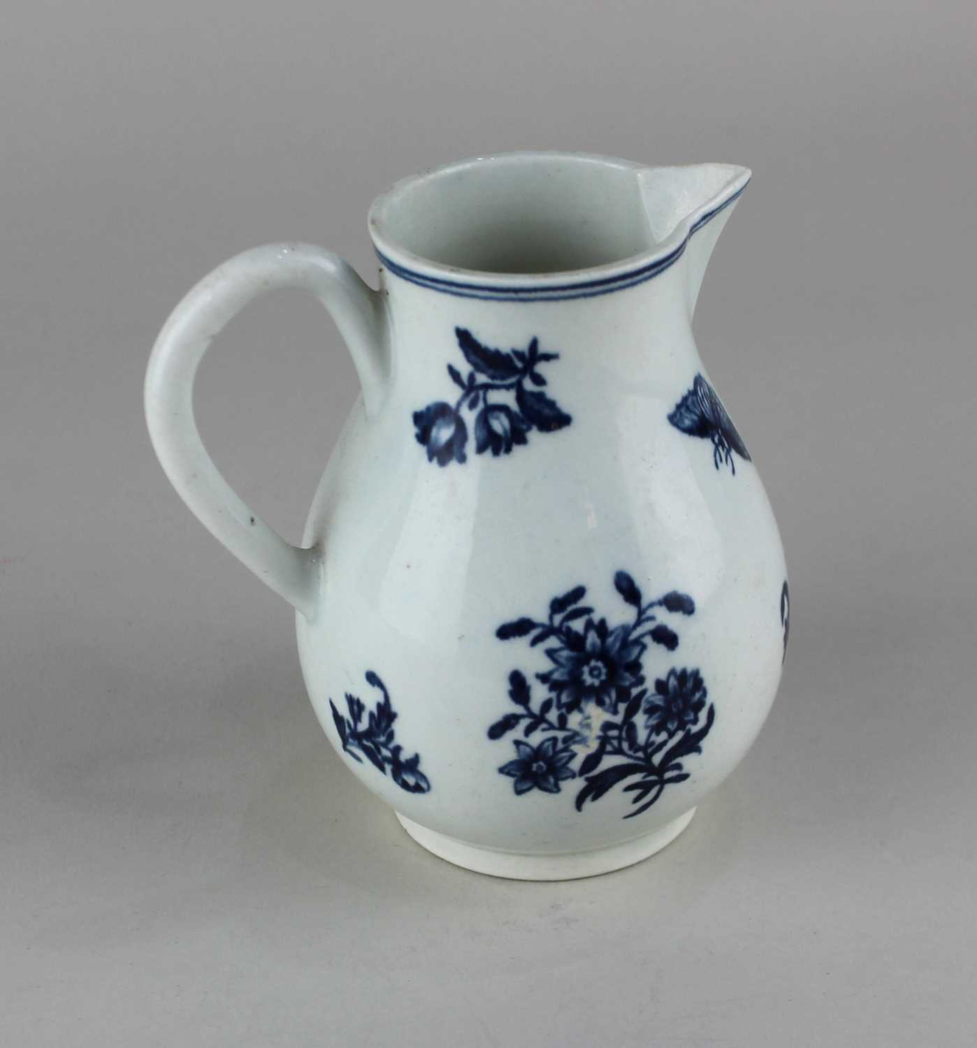 An 18th century Caughley blue and white porcelain milk jug baluster shape decorated with flowers and