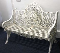 A good cast iron garden bench in the manner of Coalbrookdale, Peacock design, painted white, 122cm