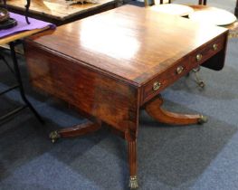 A 19th century mahogany sofa table crossbanded in rosewood, with two frieze drawers on turned