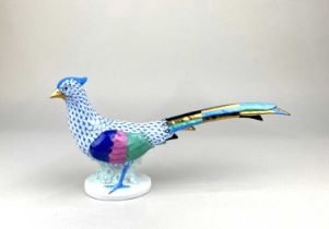 A Herend porcelain hand painted model of a pheasant with blue tipped feathers 32.5cm long