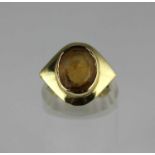 A gold and citrine single stone ring collet set with an oval cut citrine, detailed '585', ring