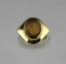 A gold and citrine single stone ring collet set with an oval cut citrine, detailed '585', ring