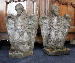 A pair of statues / gate finials modelled as eagles, weathered reconstituted stone, 20th century,