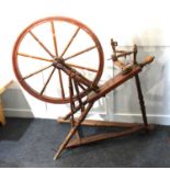 A wooden spinning wheel (a/f), 98cm