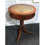 A vintage Regency revival mahogany circular side table, 20th century, having an inset leather top