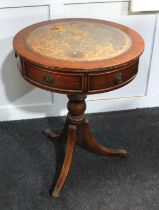 A vintage Regency revival mahogany circular side table, 20th century, having an inset leather top