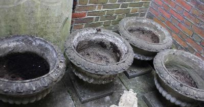 A set of four reconstituted stone Campana garden urn planters each with drainage hole 55cm high