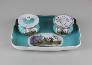 A Meissen porcelain inkstand with inkwell and sander decorated with panels of figures and horses,