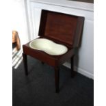 A Victorian mahogany bidet / stool lifting rectangular top with fitted shaped bidet bowl, on tapered