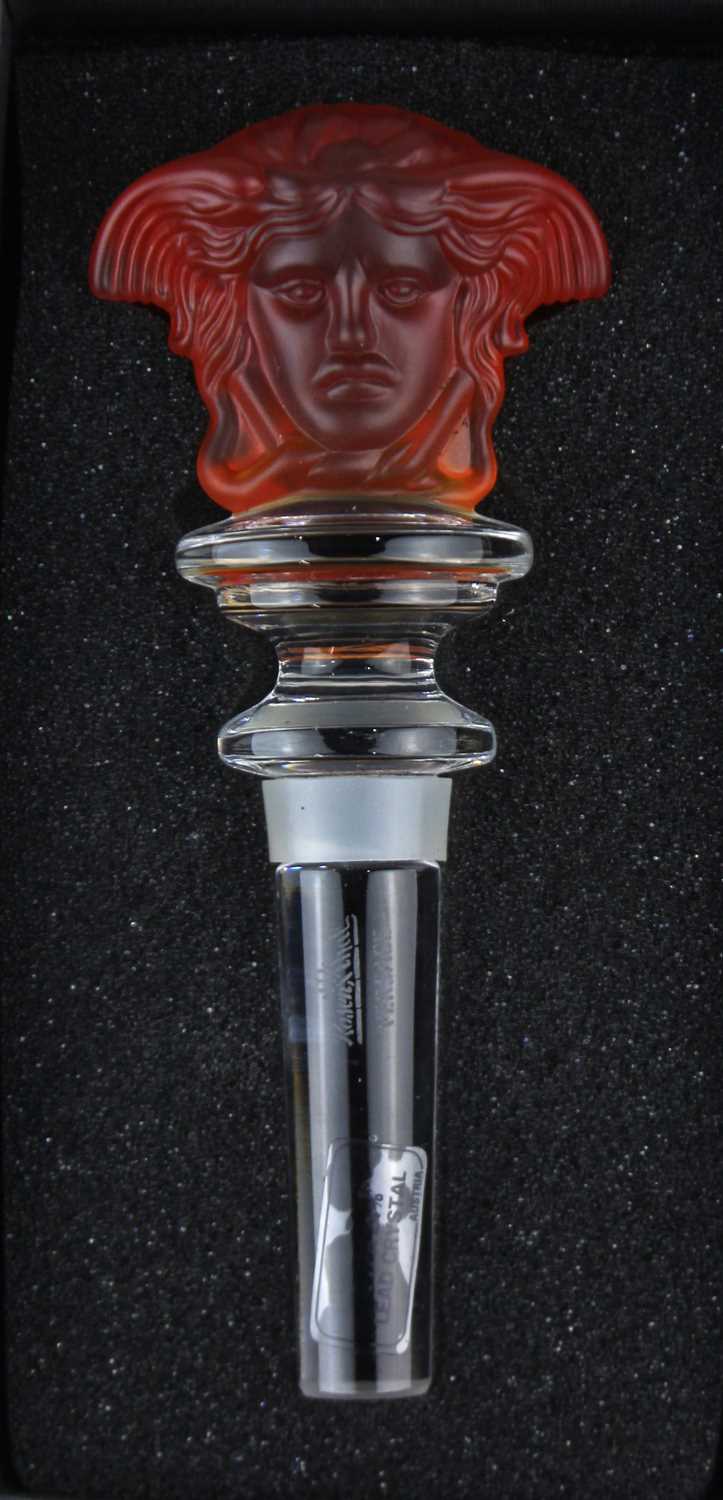 A Versace Rosenthal crystal 'Medusa' wine bottle stopper with frosted amber glass head 12.5cm,