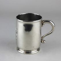 A George I Britannia Standard silver mug, with a scrolled handle, the body later engraved with a