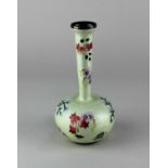 A Japanese cloisonne bottle vase with floral decoration on yellow ground, marked 'SILVER 99' to base