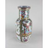 A Chinese Cantonese porcelain vase decorated with alternate figure and bird panels, surrounded by
