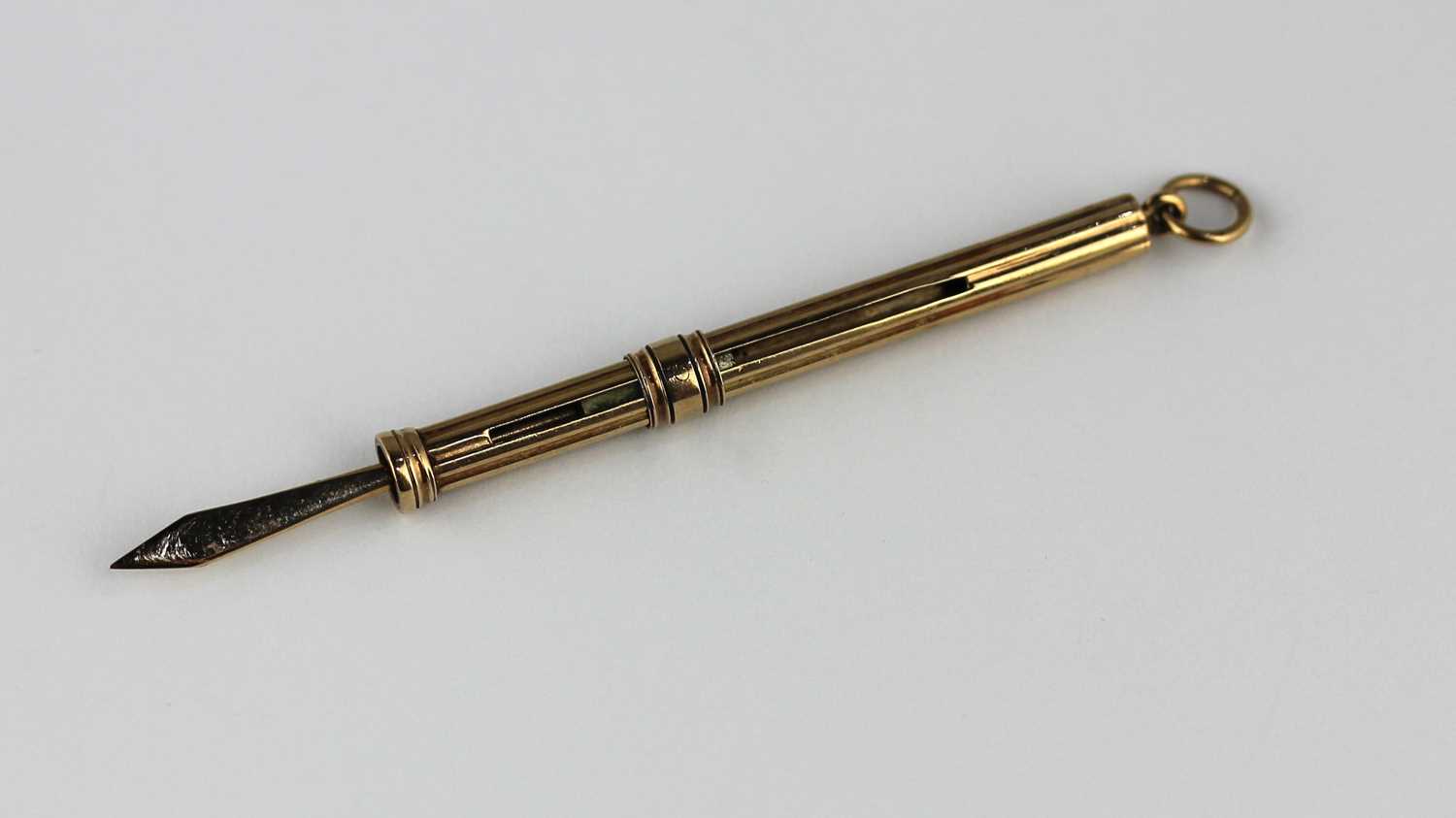 A 9ct gold slide action toothpick, Birmingham 1953, 3.6g