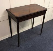 A 19th century small mahogany card table, the rectangular top with carved edge and canted corners,