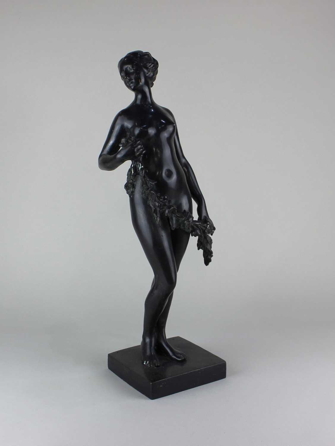 After Étienne Maurice Falconet (1716-1791), bronze figure of a female nude holding a garland of