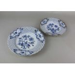 Two similar Meissen porcelain plates each with pierced woven border and blue floral design on