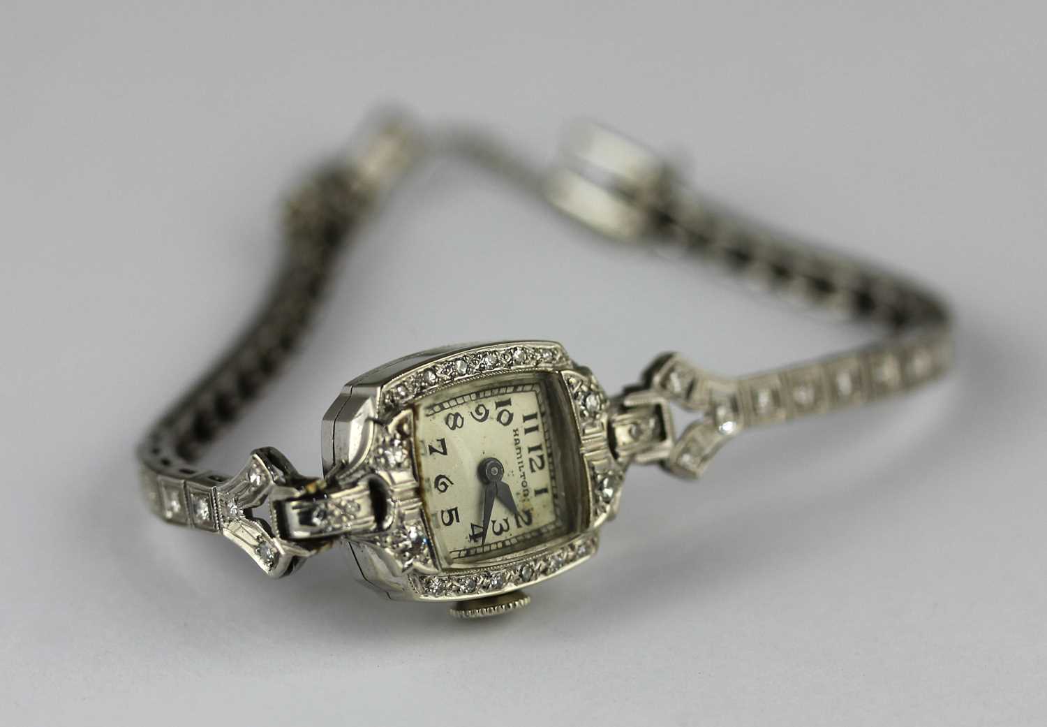 A Hamilton white gold and diamond lady's dress wristwatch with a signed jewelled movement,