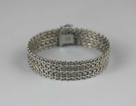 A white gold bracelet in a multiple link design on a snap clasp detailed '750', 46.2g