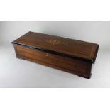 A 19th century Swiss rosewood and marquetry inlaid music box by Nicole Freres, playing twelve
