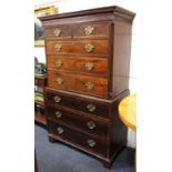 A George III mahogany chest on chest, dentil cornice above blind fret cut frieze two short and three