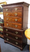 A George III mahogany chest on chest, dentil cornice above blind fret cut frieze two short and three