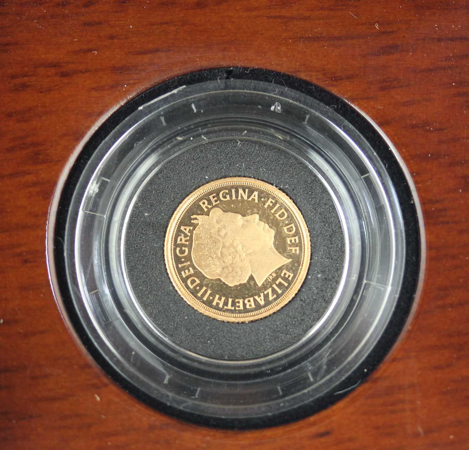 A Royal Mint gold proof quarter sovereign dated 2014 in presentation case with certificate