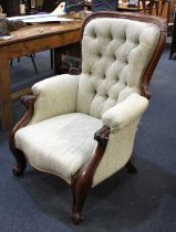 A Victorian button back armchair scroll carved frame, upholstered in woven tweed style fabric on