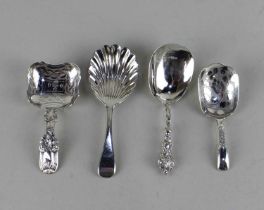 Four various 19th century silver tea caddy spoons including one with a shell shaped bowl, 1.4oz