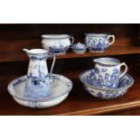A Winkle & Co 'Delph' pattern blue and white ceramic toilet set, c.1900/1910, comprising a tall jug,