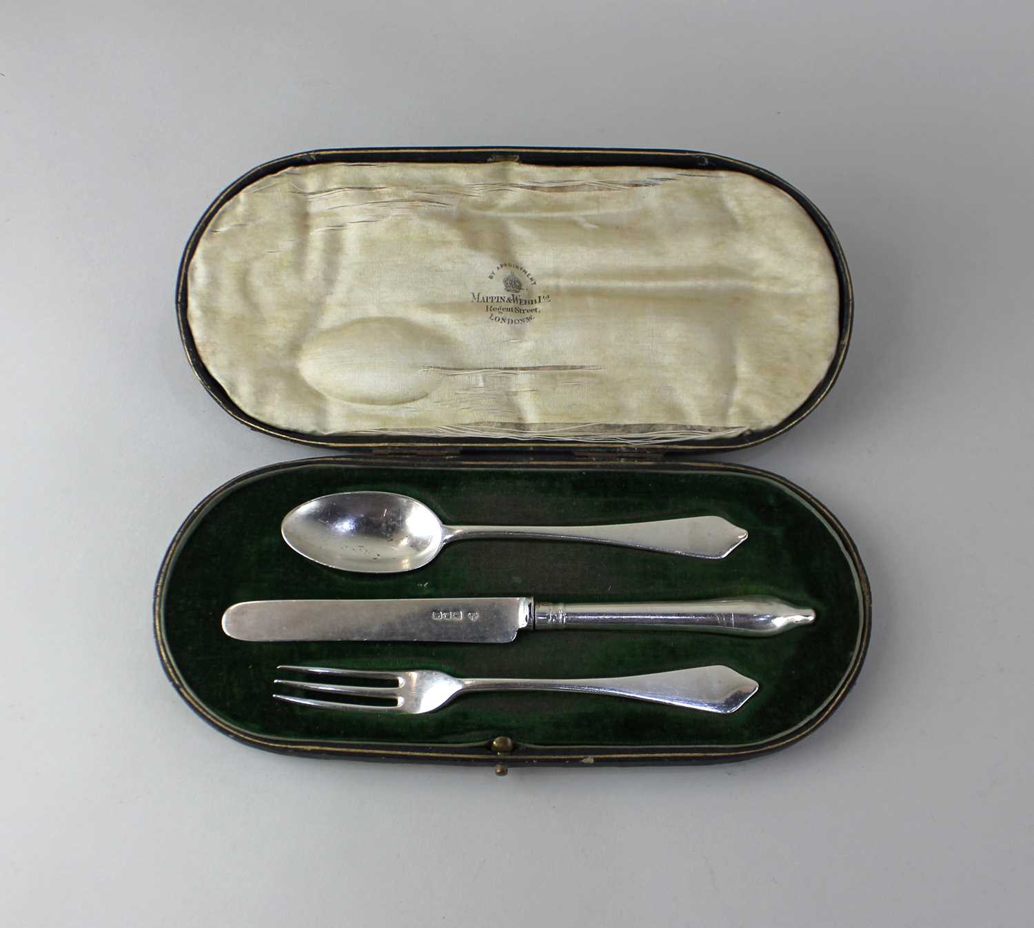 A cased George V silver three piece Christening set of knife, fork and spoon in fitted case marked