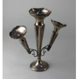 A George V silver epergne with central tapered vase and two detachable vases on loaded circular