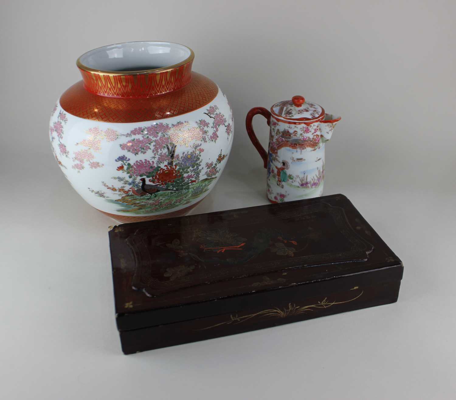 A Japanese Kutani porcelain vase decorated with birds amongst flowers, seal mark to base 26cm