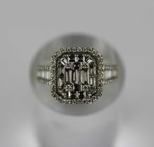 A white gold and diamond cut cornered rectangular cluster ring mounted with baguette, circular and