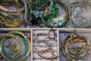 A quantity of costume jewellery and lady's watches, to include bangles, bracelets and brooches
