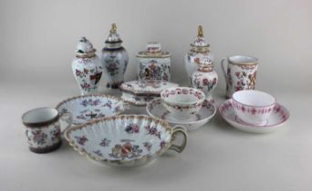 A collection of armorial porcelain comprising four vases and covers, table box, coffee can, tankard,